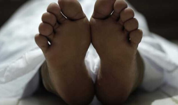 Dead Body Laying On A Floor Focus At The Foot Free Photo 750x430