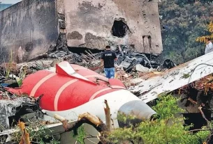 A Firefighter Stands Next To The
